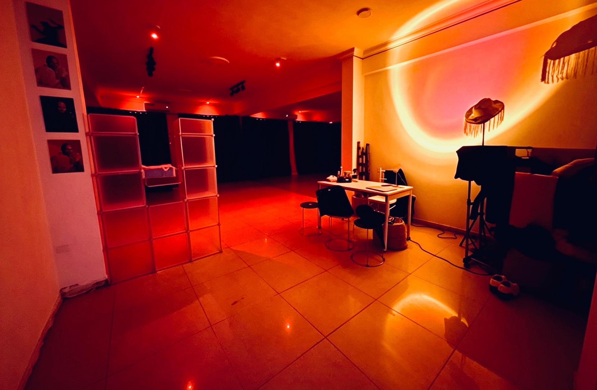Inside SKC Studios — the red-lit studio floor with brand accents